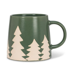 Tasse verte avec sapins