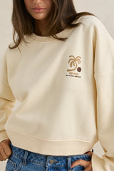 Pull à col rond ample et à motifs palmiers